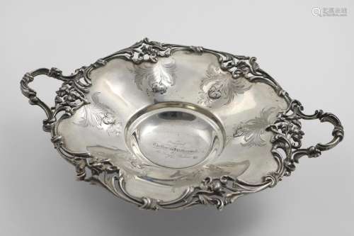 A VICTORIAN TWO-HANDLED DISH of shaped circular outline with...