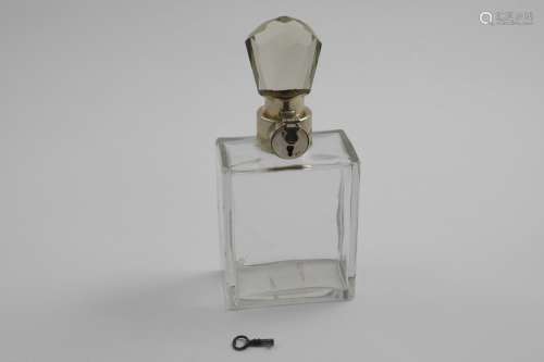 AN ART DECO MOUNTED GLASS SPIRIT DECANTER with locking stopp...