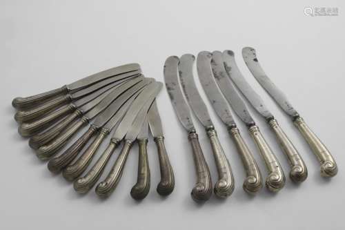 A SET OF SIX GEORGE II TABLE KNIVES with reeded pistol handl...