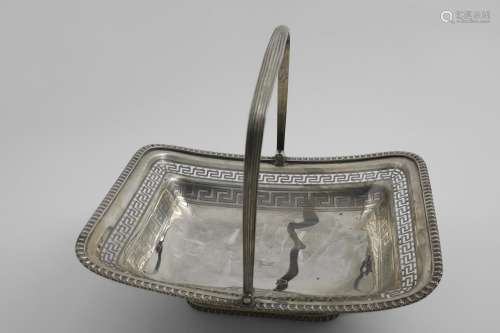 A GEORGE III CAKE BASKET rectangular with a reeded swing han...
