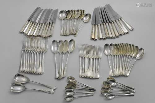 A CONTEMPORARY CANTEEN OF HANOVERIAN PATTERN FLATWARE AND CU...