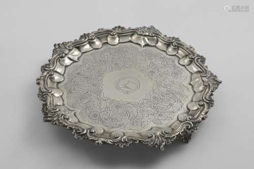 A WILLIAM IV SALVER of shaped circular outline with flat-cha...