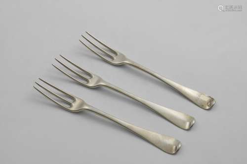 A SET OF THREE GEORGE I HANOVERIAN THREE-PRONG DESSERT FORKS...