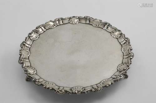 AN EARLY GEORGE III SALVER of shaped circular outline with t...