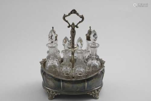 A VICTORIAN CRUET FRAME with three mounted and four stoppere...