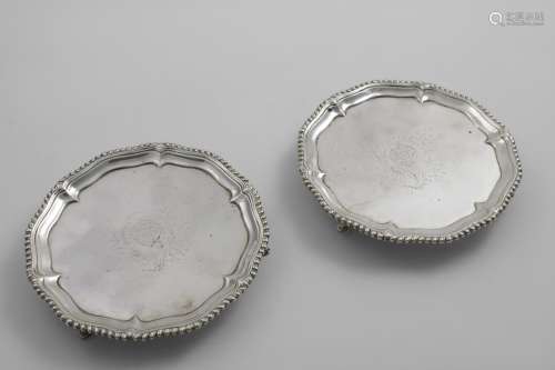 A PAIR OF EARLY GEORGE III WAITERS of shaped circular outlin...