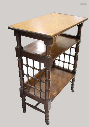 LIBERTY & CO SIDE TABLE An oak three tier table of Moorish i...