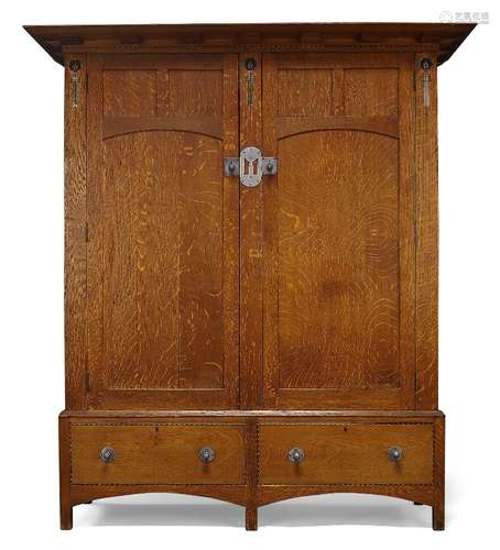 Attributed to E.G Punnett (British), an Arts & Crafts oak an...