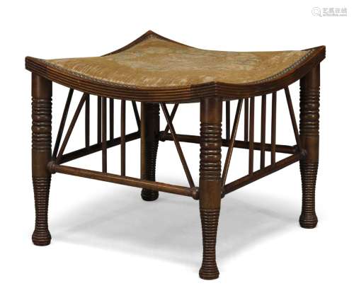 A stained beech 'Thebes' stool with upholstered seat c.1900,...