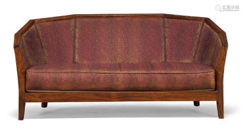 Art Deco, a rosewood two seater sofa, in the manner of Pierr...