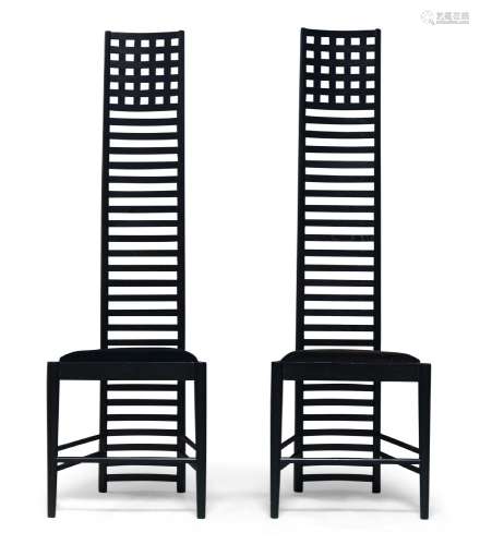 A pair of ebonised hall chairs, after a design by Charles Re...