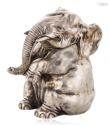 A FABERGE SILVER TABLE LIGHTER FORMED AS A SEATED ELEPHANT, ...