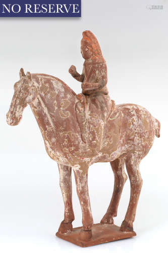 A CHINESE TERRACOTTA FIGURE OF A HORSE RIDER, TANG DYNASTY (...