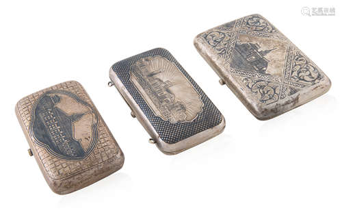 A SET OF THREE RUSSIAN SILVER AND NIELLO CIGARETTE CASES, VA...