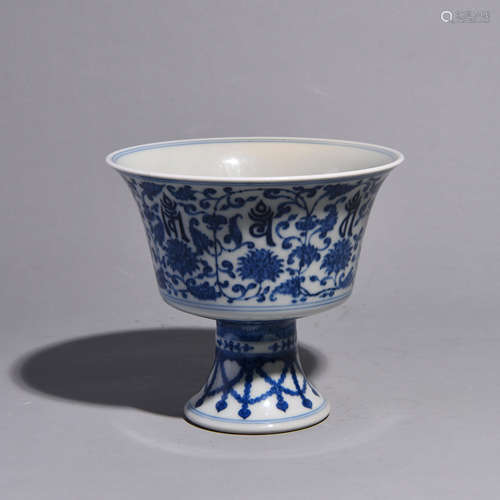 A HIGH LEGGEDC BOWL PATTERNEDC WITH BLUE FLOWER ANDC SANSKRI...