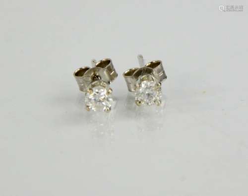 A pair of 18ct white gold and diamond earrings, the brillian...