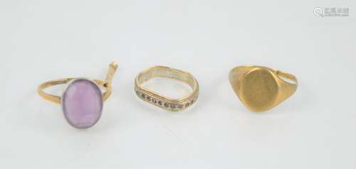 An 18ct gold and amethyst ring set in a platinum mount toget...