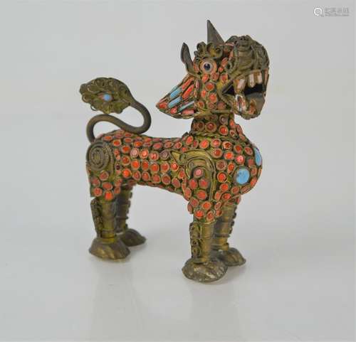 A Tibetan scent bottle in the form of a dragon with removabl...