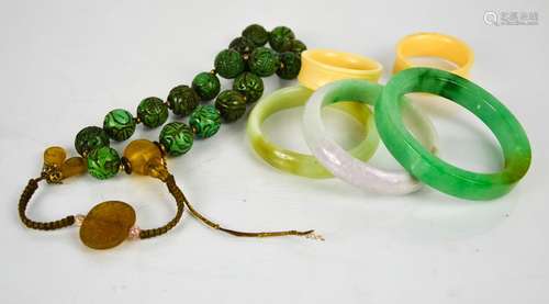 Three Chinese jade carved bangles, and a necklace of stone b...