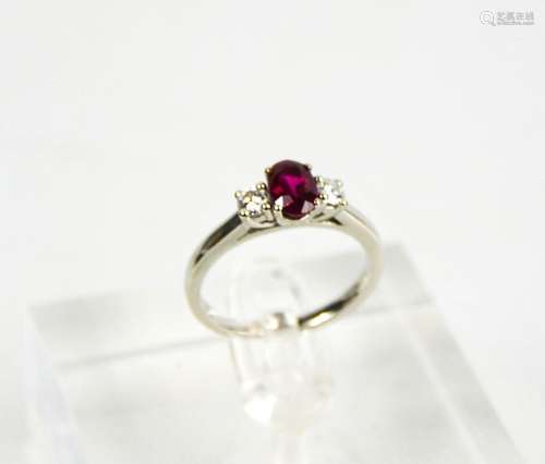 A platinum, ruby (0.88ct) and diamond (0.36ct) three stone r...