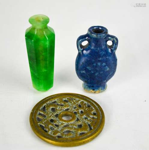 Two Chinese scent bottles and a pierced brass medallion.