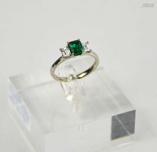 A platinum, emerald (0.83ct), and diamond (0.58ct total) thr...