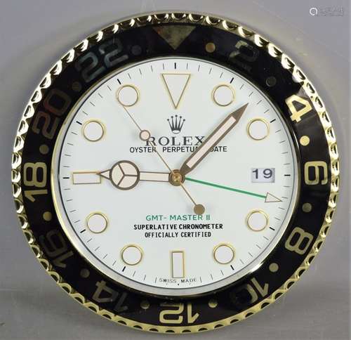 A Rolex dealers display clock, wall hanging. 34cm diameter.