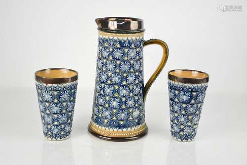 A Doulton stoneware glazed jug and matching beakers, with si...