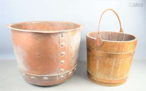 A 19th century riveted copper cauldron together with a woode...