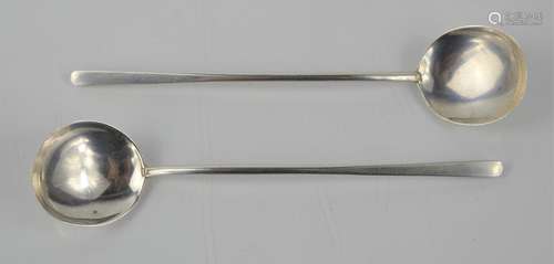 A pair of slim handled sugar spoons by Stokes & Ireland Ltd,...