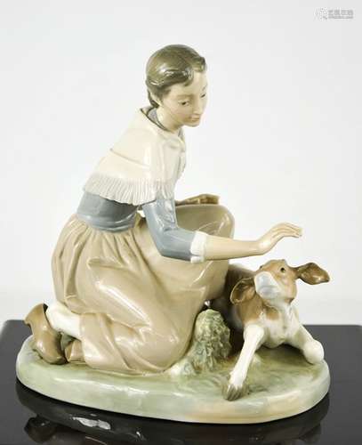 A Lladro porcelain group titled Caressing a Little Calf, num...