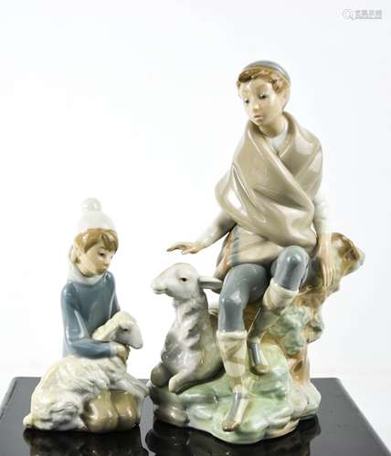 Two Lladro porcelain figurines: boy with lamb and Shepherd s...