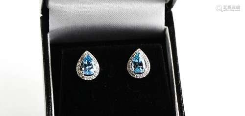 An 18ct white gold, aquamarine and diamond pair of earrings,...