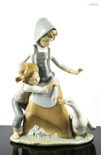 A Lladro porcelain figure group titled Avoiding the Goose, n...