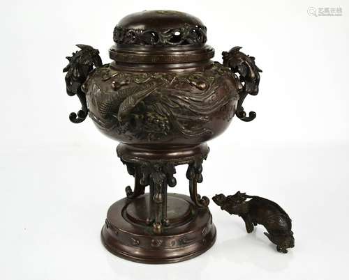 A Chinese 19th century bronze censor, modelled with dragons ...