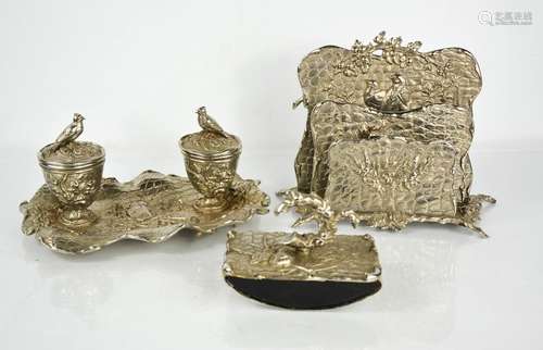 An Edwardian silvered metal desk set, comprising blotter, le...