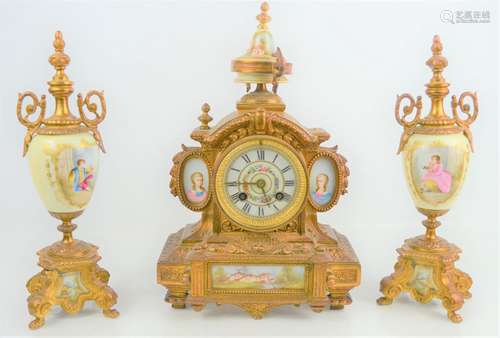 A 19th century French gilded metal and porcelain clock garni...