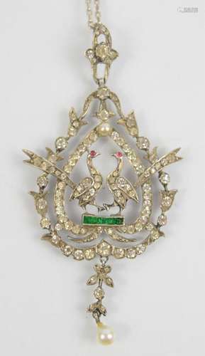 A silver pearl and paste pendant necklace depicting two phea...