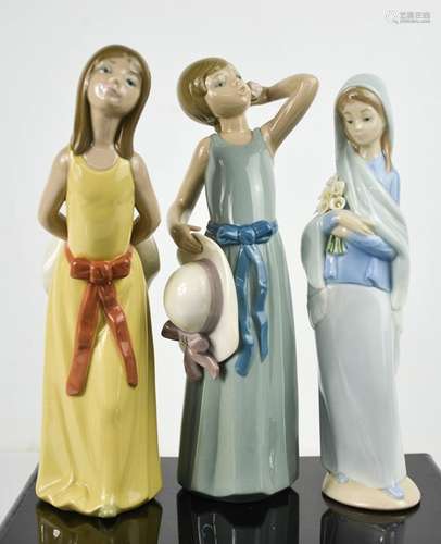 Three Lladro porcelain figurines including with Girl with Ca...