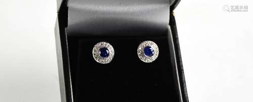 A platinum, blue sapphire (0.8ct) and diamond (0.30ct total)...