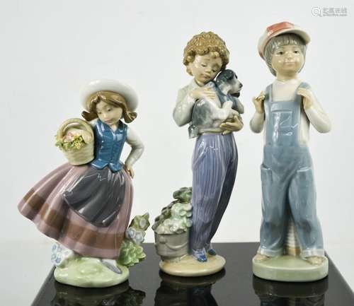 Three Lladro porcelain figurines: Boy From Madrid; with blue...