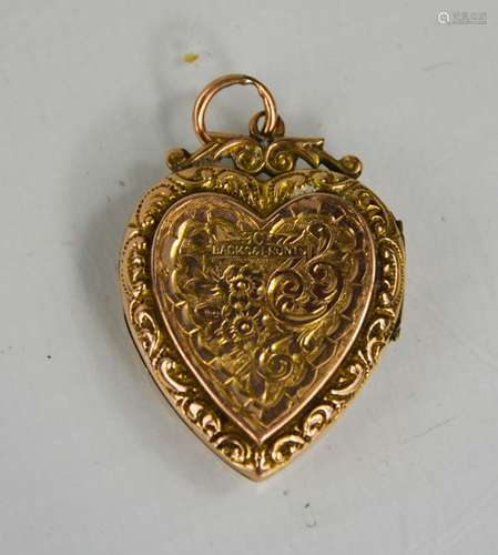 A 9ct antique rose gold heart form locket, engraved with cha...