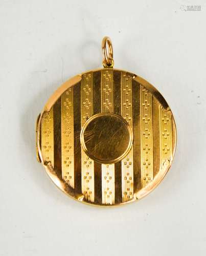 A 9ct gold circular locket, with vacant cartouche and machin...