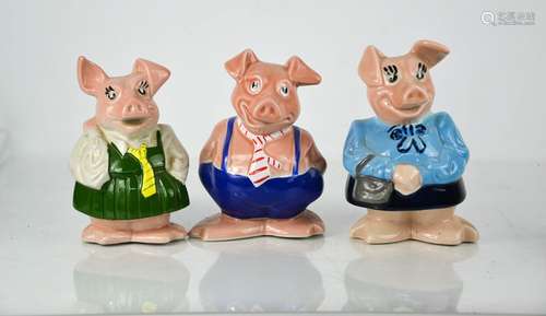 Three Wade Natwest piggy banks.