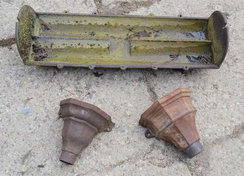 A pig trough and a pair of Victorian drain hoppers.