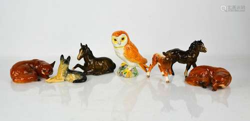 A group of Beswick, to include two ponies, two foxes, calf, ...