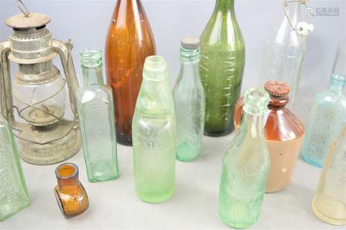 A group of collectible glass bottles to include Bovril and H...