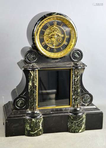 A large 19th century slate and marble mantle clock with blac...