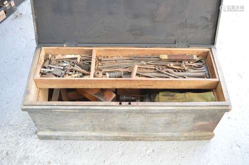 A wooden tool chest with a quantity of vintage tools and pla...