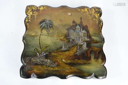 A 19th century black laquered paper mache box, the lid decor...